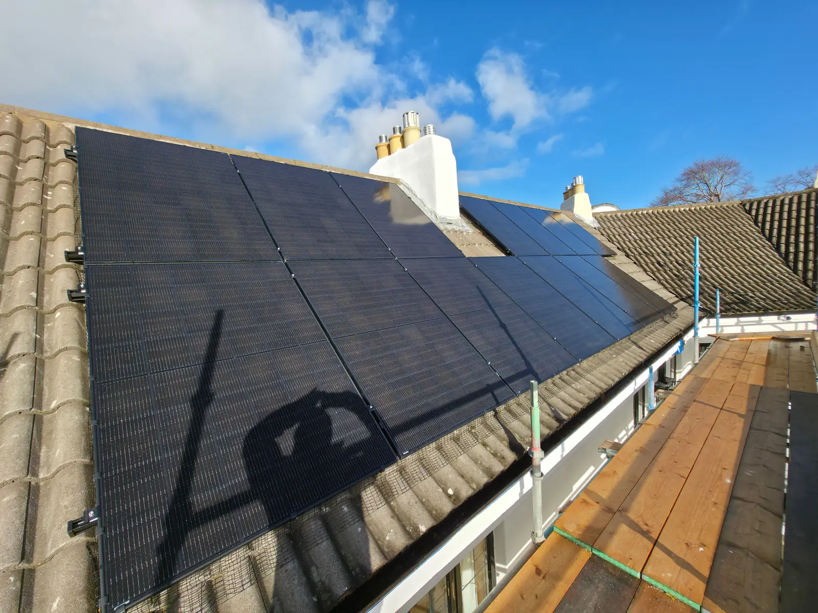 Full solar panel array fitted across a tiled roof in Edinburgh